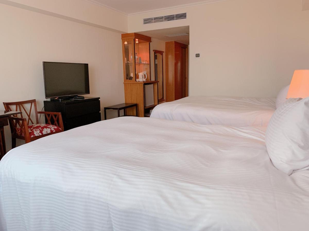 The Howard Plaza Hotel Kaohsiung Eksteriør billede A room at the hotel